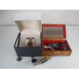 A carved Eastern trinket box containing gents wrist watches including Citron etc, a silver ring,