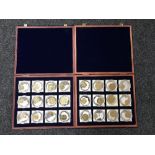 Two fitted teak coin cases each containing twelve coins - The History of British Currency.