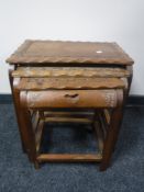 A nest of three oriental style tables,