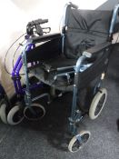 A folding wheel chair together with a folding walking aid