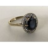 A 9ct gold sapphire diamond cluster ring, size O.