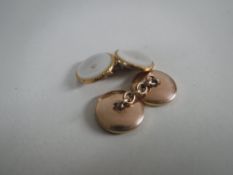 A pair of 14ct gold and mother of pearl cufflinks