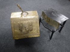 A brass embossed coal box with shovel and liner and a antique footman