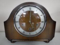 A walnut cased Smiths Westminster chiming mantel clock with pendulum and key