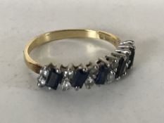 An 18ct gold sapphire and diamond half eternity ring, size N.