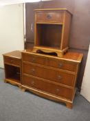 An inlaid yew wood four drawer chest and pair of matching bedside stands