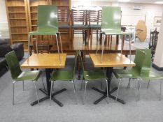 Two square oak topped cafe tables on metal pedestals and seven stacking cafe chairs