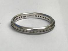 A platinum diamond eternity ring,