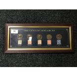 A 20th Century Monarchs presentation coin and stamp montage comprising five coins and five stamps,