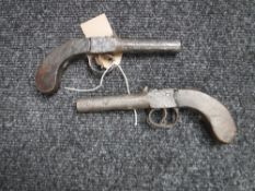 A pair of antique percussion cap pistols,