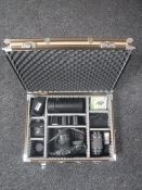 An aluminium camera case containing Pentax SF7,