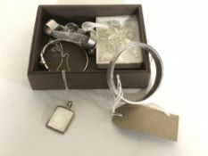 A box of approximately ten items of silver jewellery, bangles, rings,