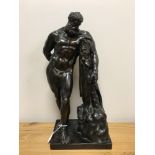 A nineteenth century bronze sculpture depicting The Farnese Hercules standing by a stump,