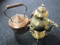 An antique copper and brass kettle together with a brass spirit kettle on stand