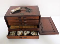 A mahogany cased Mahjong set CONDITION REPORT: The tiles are 3cm by 2cm.