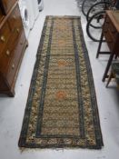 An antique North-West Persian runner CONDITION REPORT: Losses at both ends.