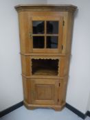 A continental oak corner cabinet