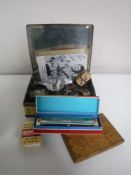 A vintage tin of Whyte & McKays matchbox whisky, Bandmaster harmonica,