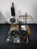 Three photographic enlargers and a box of enlarger lamps