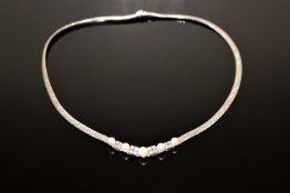 An 18ct white gold necklace set with pearls and diamonds, approximately 0.9ct. 28.