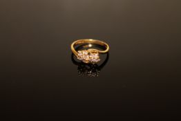 An 18ct gold double cluster ring
