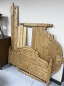 A pine 4' 6" bed frame