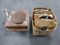 An early 20th century oak table top gramophone and a box of 78's