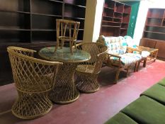 A three piece conservatory suite, together with a bamboo and wicker circular table,