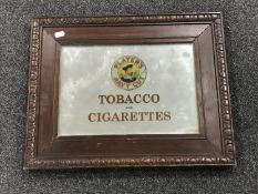 An early 20th century and later oak framed mirror bearing "Player's Navy Cut Tobacco" advertisement