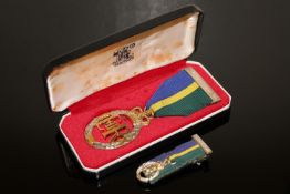An Elizabeth II Territorial & Army Volunteer Reserve decoration in silver with miniature,