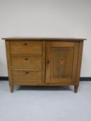 An early twentieth century continental oak sideboard fitted three drawers