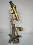 An antique R & J Beck brass microscope (parts missing)