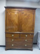 A George III inlaid mahogany linen press, with dentil moulded cornice,