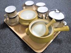 A tray containing fourteen piece Denby stoneware coffee set together with three Denby stoneware