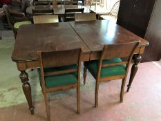 An early twentieth century mahogany dining table together with a set of four chairs