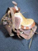 A 20th century tooled leather saddle