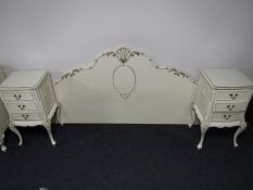 A cream and gilt continental headboard together with pair of matching bedside chests