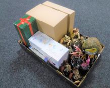 A box containing boxed Butterfly Fairies figures, continental figurines, three dragon figures,