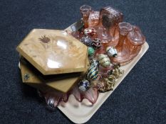 A trinket box of costume jewellery and a quantity of metal eggs on stands,