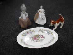 A Beswick figure of a terrier together with a Nao figure of a girl,