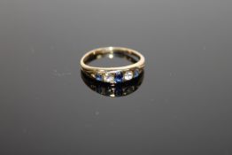 An 18ct gold diamond and sapphire ring, size L, 2.5g.