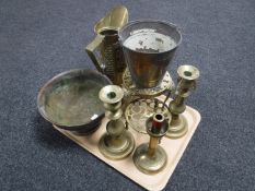 A tray of brass and copper including embossed jugs, trivet,