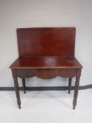 A Regency mahogany foldover top tea table