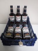 A crate of six bottles of Lamb's Navy Rum