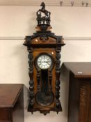 An impressive Victorian mahogany wall clock with enamelled dial