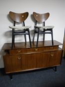 A mid 20th century G Plan sideboard and a pair of chairs