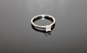 An 18ct white gold diamond solitaire ring, approximately 0.