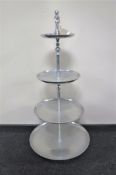 A stainless steel catering four tier cake stand