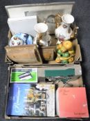 Two boxes containing boxed Dema wine glasses, assorted table cutlery, china teapots,