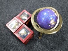 A Lapis gemstone globe on stand together with three further boxed desk globes